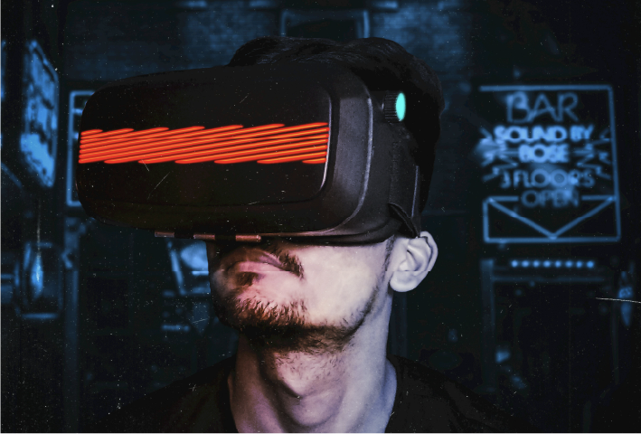 Man wearing a VR headset with neon lights in a futuristic setting